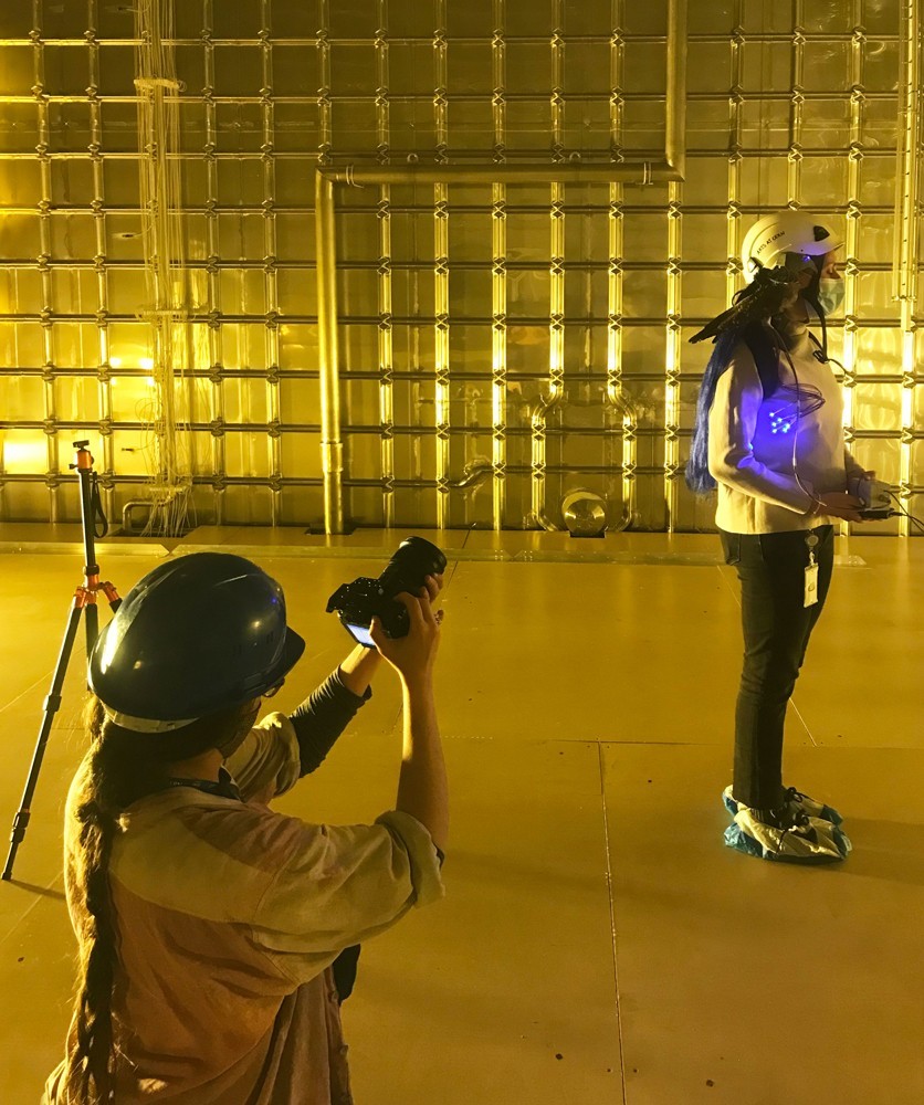 Patricia Domínguez filming at one of the ProtoDUNE detectors with Head of Arts at CERN Mónica Bello. Photo by Iliana Tatsi © CERN