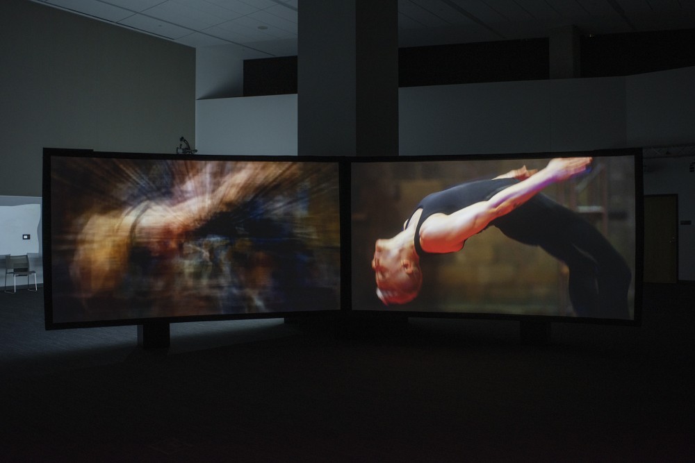 An image of dancer appears in two of the eight-channel video installation of Collective Entanglements at the Spencer Museum of Art, 2022